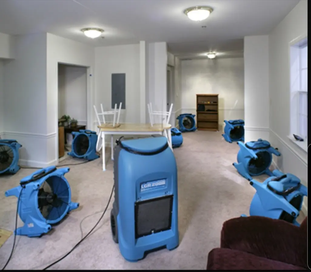 Air movers and dehumidifier setup for Water Damage Restoration in Olive